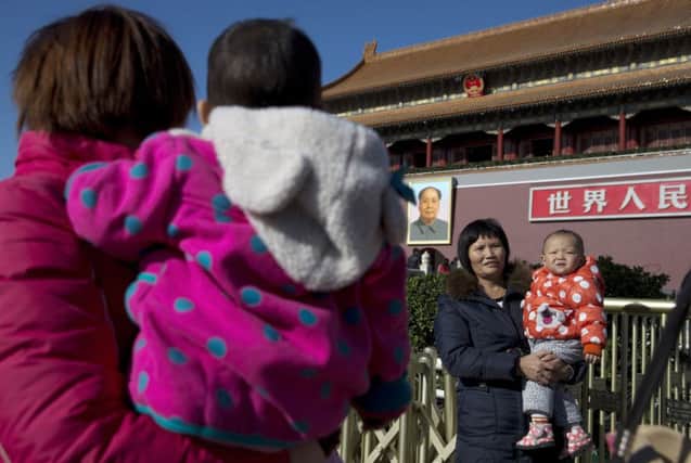 Critics are calling for the abolition of Chinas strict family planning policies. Picture: AP