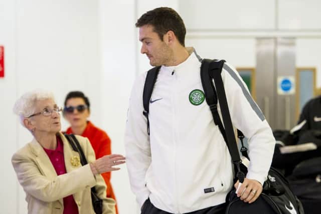 Craig Gordon attracts some attention as the squad returned to Glasgow Airport. Picture: SNS