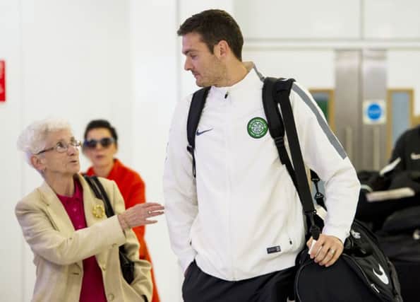 Craig Gordon attracts some attention as the squad returned to Glasgow Airport. Picture: SNS