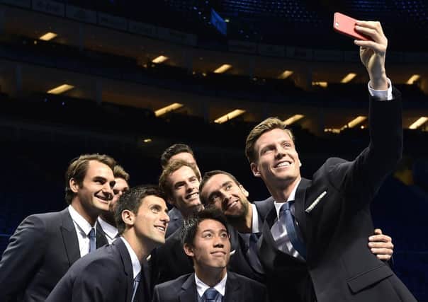 Tomas Berdych, right, takes a selfie with fellow tennis players. Picture: Reuters