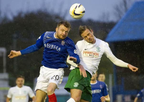 Cowdenbeath's Kyle Miller battles for the ball with Danny Handling. Picture: SNS