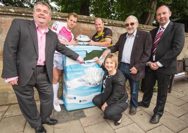 Players from Melrose rugby club help to launch the new broadband  service in the town. Picture: TSPL