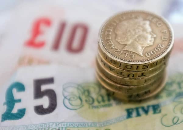 The Financial Conduct Authority (FCA) said default fees will be capped at £15 alongside a limit of 0.8% per day on interest on unpaid balances. Picture: PA