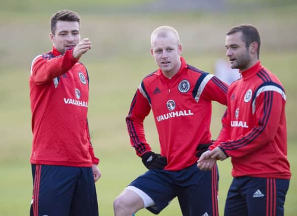 Russell Martin, left, chats with Steven Naismith and Shaun Maloney during a training session. Picture: SNS
