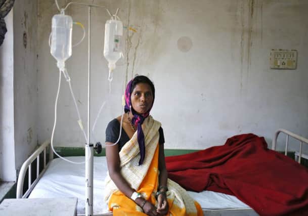 A woman in hospital in Bilaspur after sterilisation surgery. Picture: Reuters
