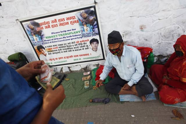 A man and his wife collect money to help get a transplant for their son. Picture: AP