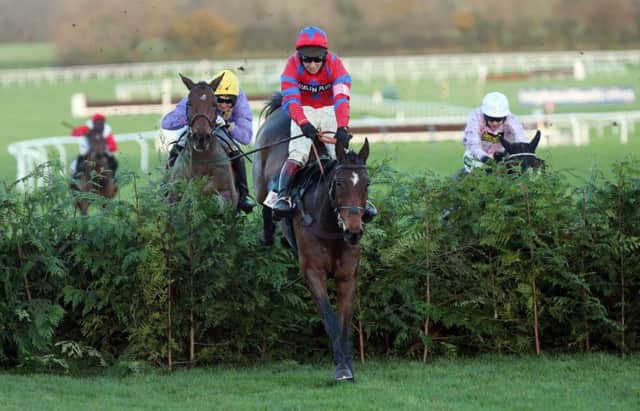 Balthazar King, ridden by Richard Johnson, jumps the last on the way to victory. Picture: PA