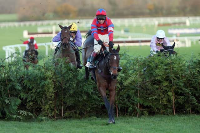 Balthazar King, ridden by Richard Johnson, jumps the last on the way to victory. Picture: PA