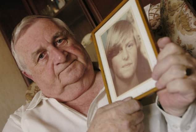 Morain Scott, Helen's father, with a picture of his daughter. Picture: Danny Lawson