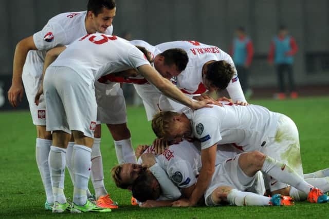 Party time for Poland after they score four without reply against Georgia in Tbilisi. Picture: Getty