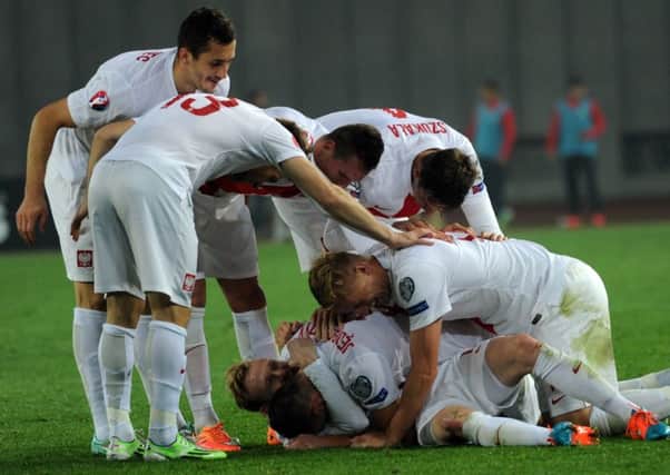 Party time for Poland after they score four without reply against Georgia in Tbilisi. Picture: Getty