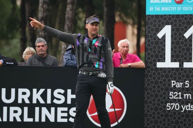 Ian Poulter signals at the 11th. He also hit a tree at the 15th. Picture: Ian Walton/Getty Images