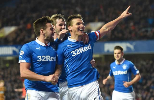 Rangers captain Lee McCulloch (centre) celebrates getting on the score sheet. Picture: SNS