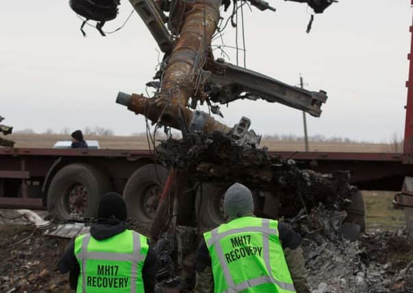 MH17 debris is recovered under the watch of Dutch officials in Donetsk, Ukraine. Picture: Getty