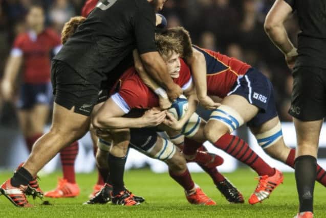 Scotland lock Jonny Gray finds his way blocked as he embarks on a trademark ballcarry against New Zealand. Picture: Jane Barlow