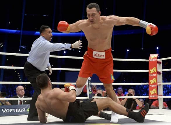 Wladimir Klitschko knocks down challenger Kubrat Pulev during Saturday nights title fight. Picture: Reuters