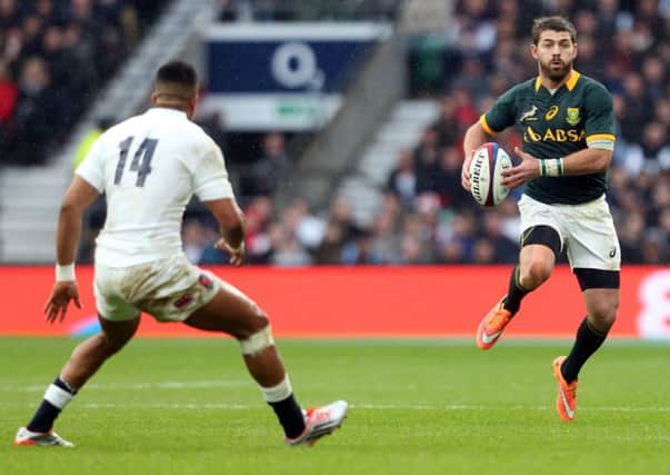 Willie le Roux of South Africa considers his options in front of England Test debutant Anthony Watson at Twickenham. Picture: Getty