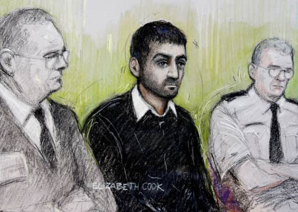 Court artist sketch of Erol Incedal (centre), who was found guilty by the jury of possessing a bomb making document on a memory card which was likely to be useful to a terrorist. Picture: PA