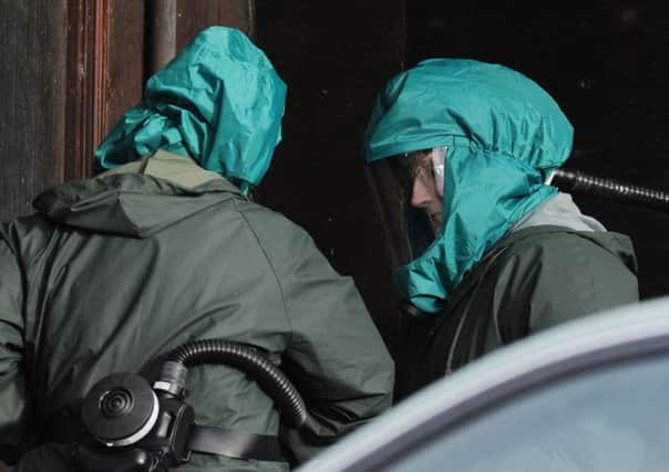 Health officials wearing protective clothing prepare to enter a duck shed at a farm near Nafferton, East Yorkshire. Picture: Getty