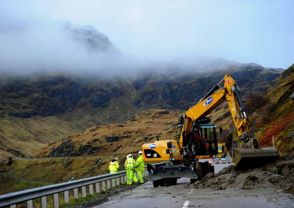 Civil engineers work to clear a landslip from the A83. Picture: Robert Perry