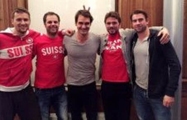 Stan Wawrinka makes bunny ears behind Roger Federer in the picture tweeted by Federer this week