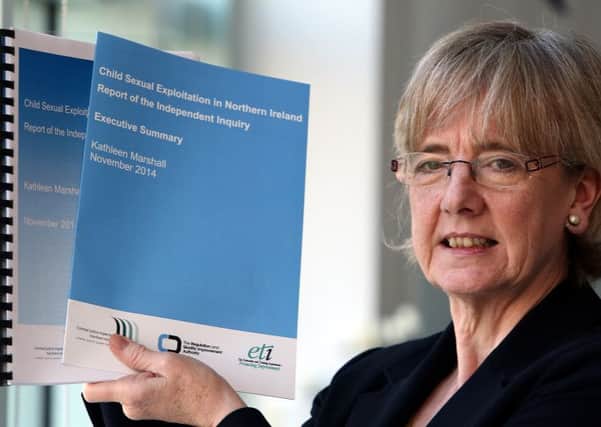 Professor Kathleen Marshall holds her report on child sexual exploitation in Northern Ireland. Picture: PA