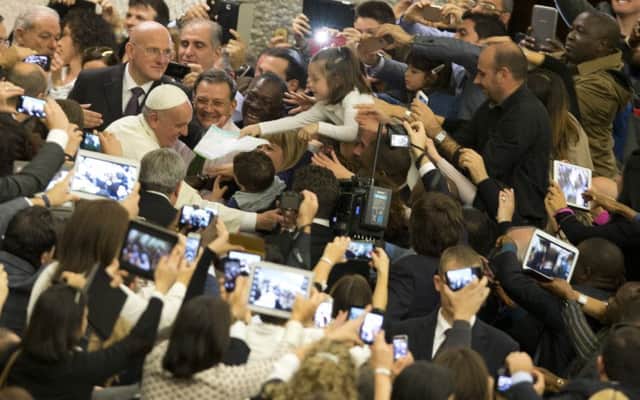 The Vatican and Pope Francis are on board with the tech age. Picture: AP