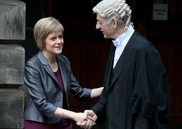 Nicola Sturgeon with the Principle Clerk Graeme Marwick as she leaves the Court of Session in Edinburgh. Picture: Hemedia