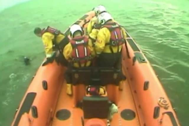 The lifeboat crew reach the dog in the Firth of Forth. Picture: YouTube
