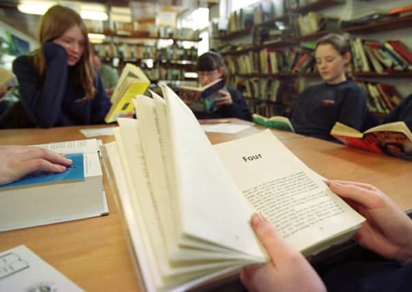 One in five schoolchildren from poorer backgrounds entering high school are struggling with their reading, according to new figures. Picture: TSPL