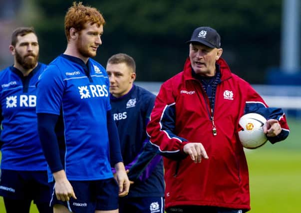 Scotland coach Vern Cotter (right) and Rob Harley chat during training. Picture: SNS