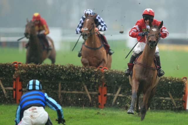 Peter Buchanan steers the Lucinda Russell-trained Thorpe, a 25-1 shot, away from Jason Maguire. Picture: PA