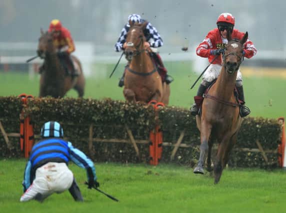 Peter Buchanan steers the Lucinda Russell-trained Thorpe, a 25-1 shot, away from Jason Maguire. Picture: PA