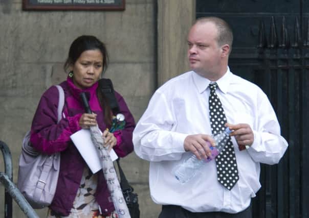 Gavin Sangster leaves court with wife Erlinda. Picture: PA