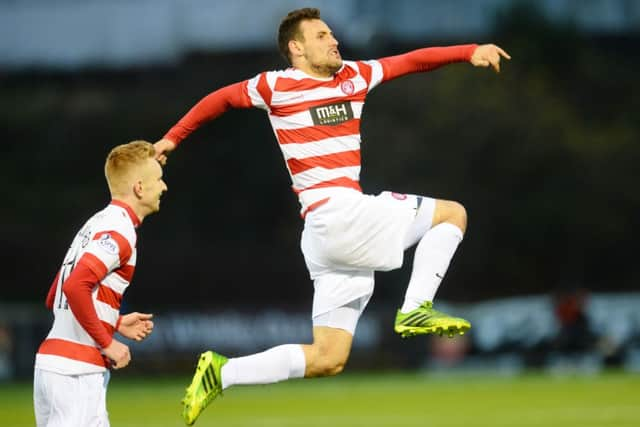 Airborne Andreu: Hamilton's Tony Andreu celebrates firing Accies into the lead. Picture: SNS