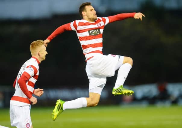 Airborne Andreu: Hamilton's Tony Andreu celebrates firing Accies into the lead. Picture: SNS
