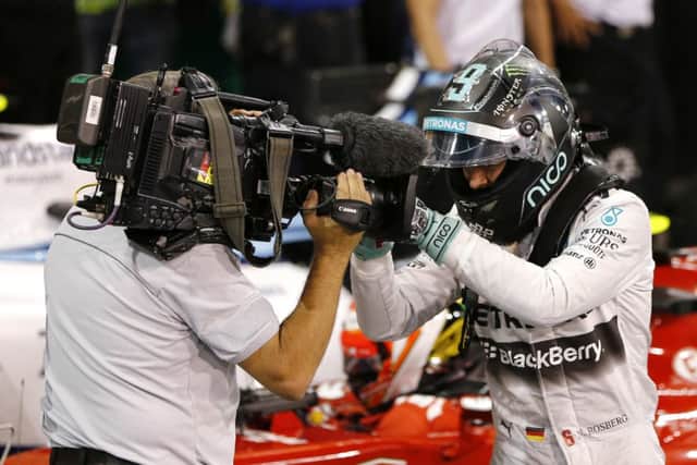 Nico Rosberg reacts to a television camera after taking pole position. Picture: Reuters