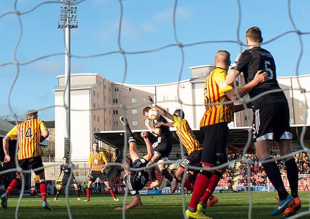 Partick Thistle's Abdul Osman (3rd right) concedes a penalty for handling the ball in his own box. Picture: SNS