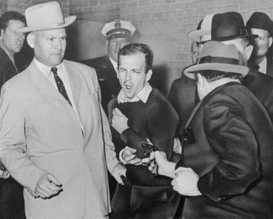 Lee Harvey Oswald, alleged killer of president John F Kennedy, shot dead by Jack Ruby in Dallas on this day in 1963. Picture: AP