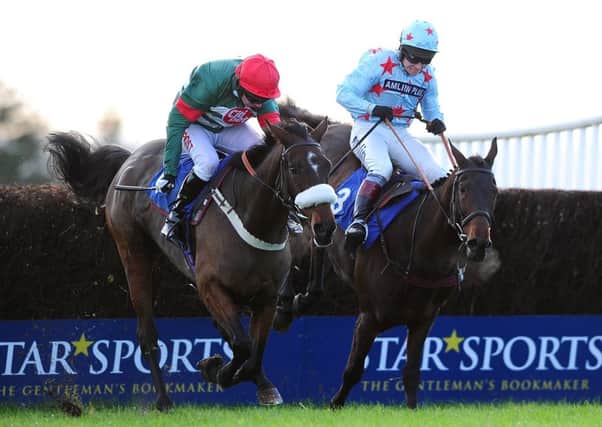 Return Spring, right, ridden by Richard Johnson wins the Steeple Chase at Exeter. Picture: Getty