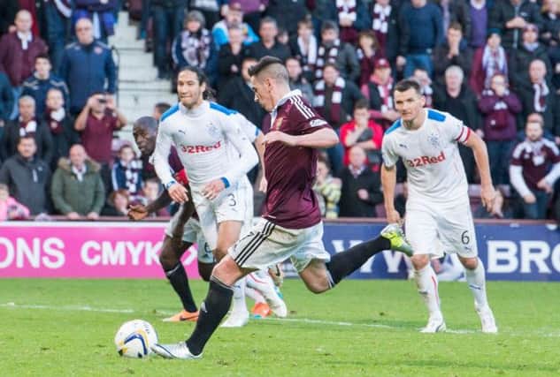 Jamie Walker scores from the penalty spot during the 2-0 victory over Rangers at Tynecastle. Picture: Ian Georgeson
