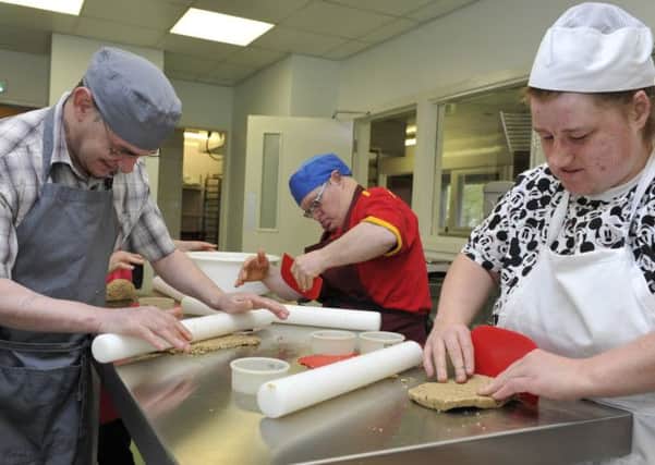 Adults with learning disabilities working at 'Bread Works' in Tweedbank making seaweed oatcakes to sell. Picture: TSPL