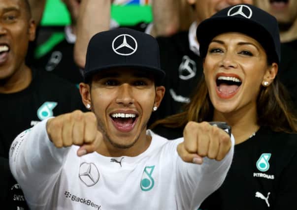 Lewis Hamilton and his girlfriend Nicole Scherzinger celebrate after his World Championship triumph in Abu Dhabi. Picture: Getty