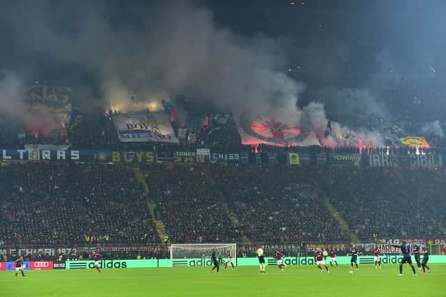 Inter Milans supporters light fireworks during the derby with AC Milan. Picture: AFP/Getty