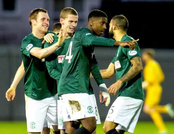 Dominique Malonga scored an fine hat-trick for Hibs after an emotional trip to Africa. Picture: SNS