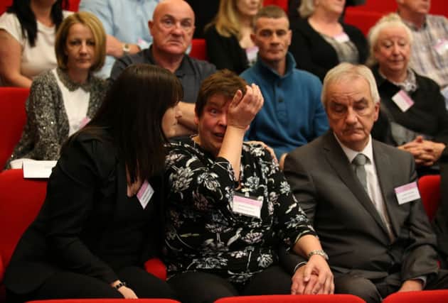 Family members react as the report is read out by Lord MacLean. Picture: PA