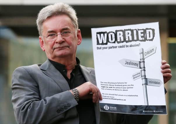 Clare's father Michael presents an advert outside the Scottish Parliament in Edinburgh. Picture: PA