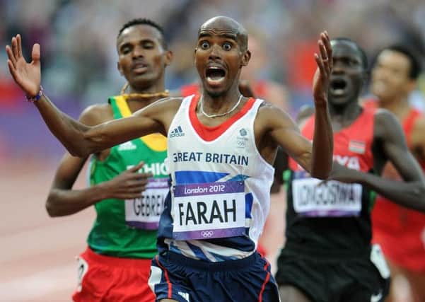 Mo Farah celebrates as he crosses the finish line to win the 5000m at London 2012.  Picture: Ian Rutherford