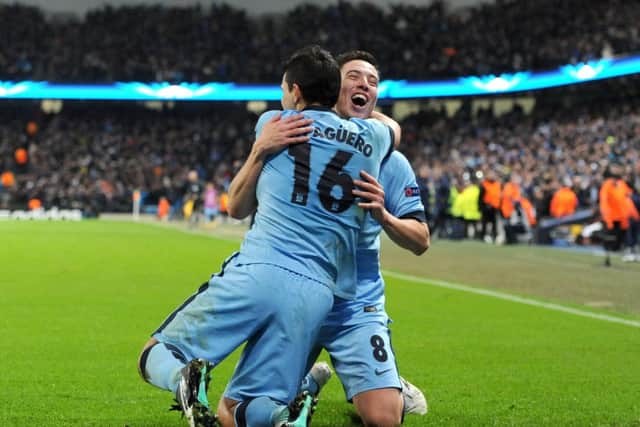 Manchester Citys Sergio Aguero, left, celebrates scoring his sides third goal with Samir Nasri. Picture: PA