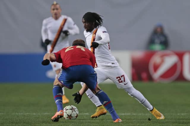 Roma striker Gervinho takes on Vasili Berezutski of CSKA Moscow during the Champions League match. Picture: AP